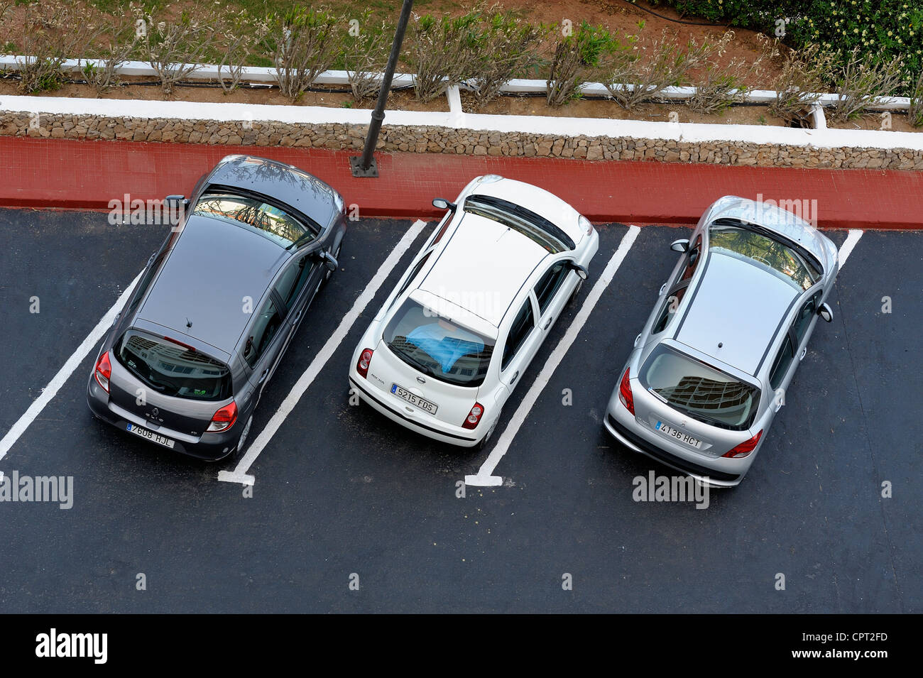 3 noleggio auto parcheggiata in un parcheggio per auto Arenal d'en Castell Minorca isole Baleari Spagna Foto Stock