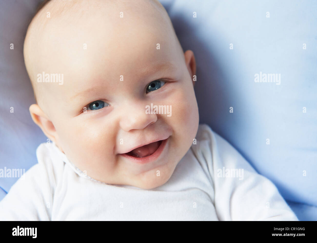 Close up di lattanti faccia ridere Foto Stock