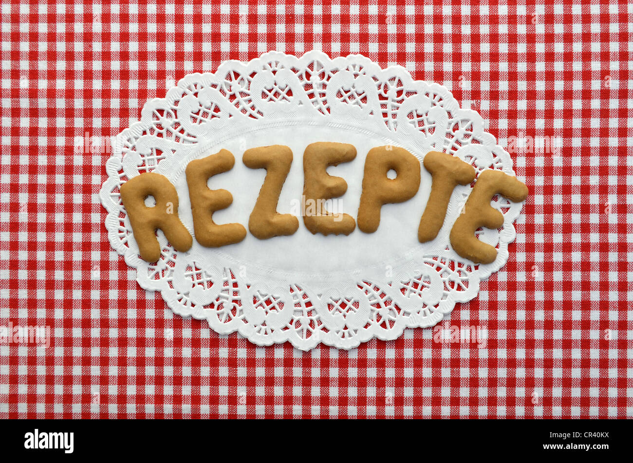 Rezept o ricetta scritta in alfabeto i biscotti su carta centrino Foto Stock