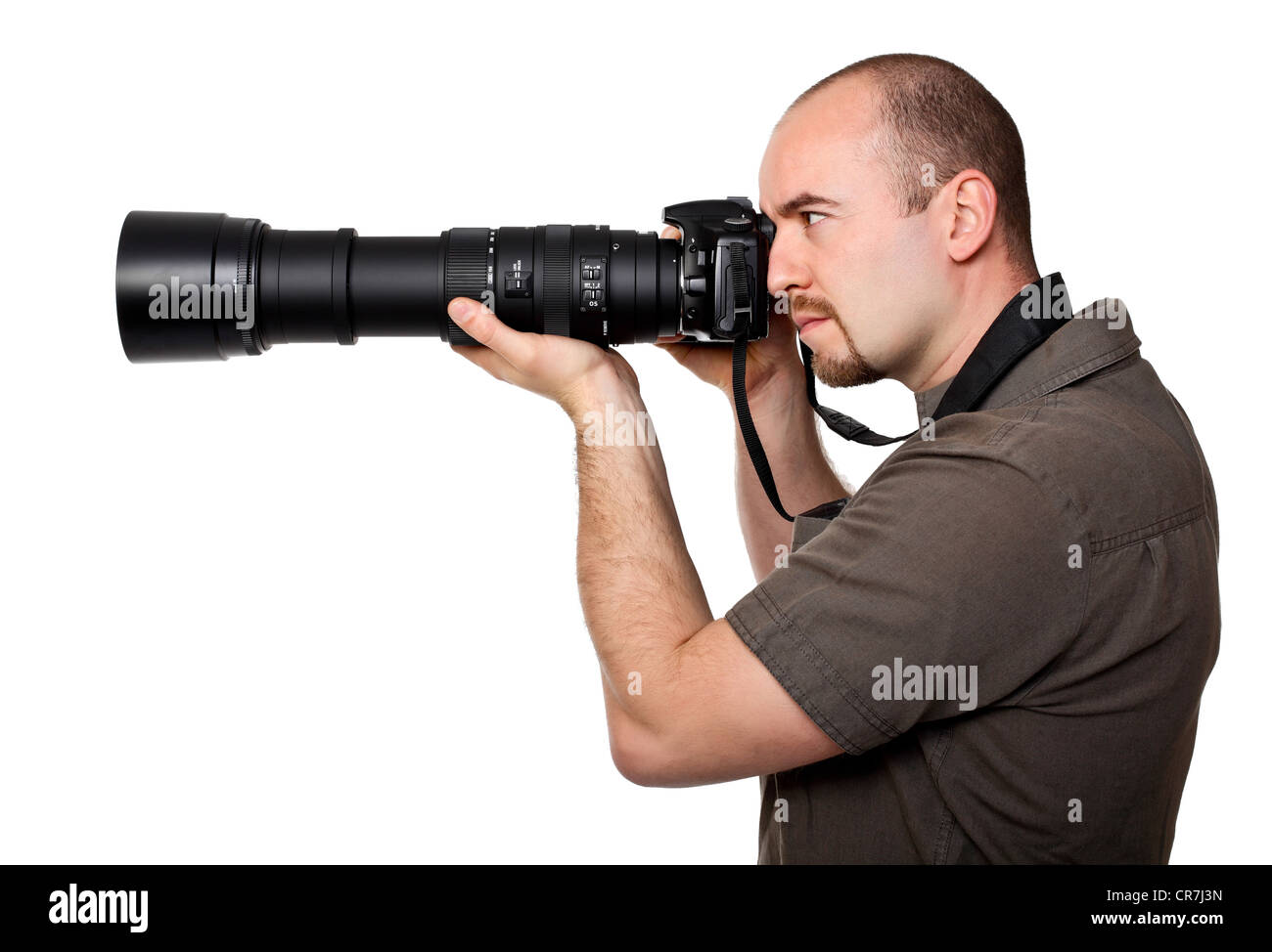 Uomo con telecamera e obiettivo enorme Foto Stock