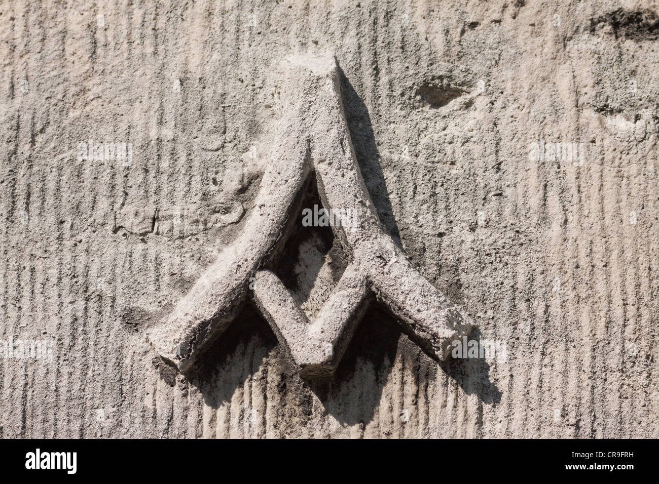 Close-up di pietra alfa su una parete Foto Stock