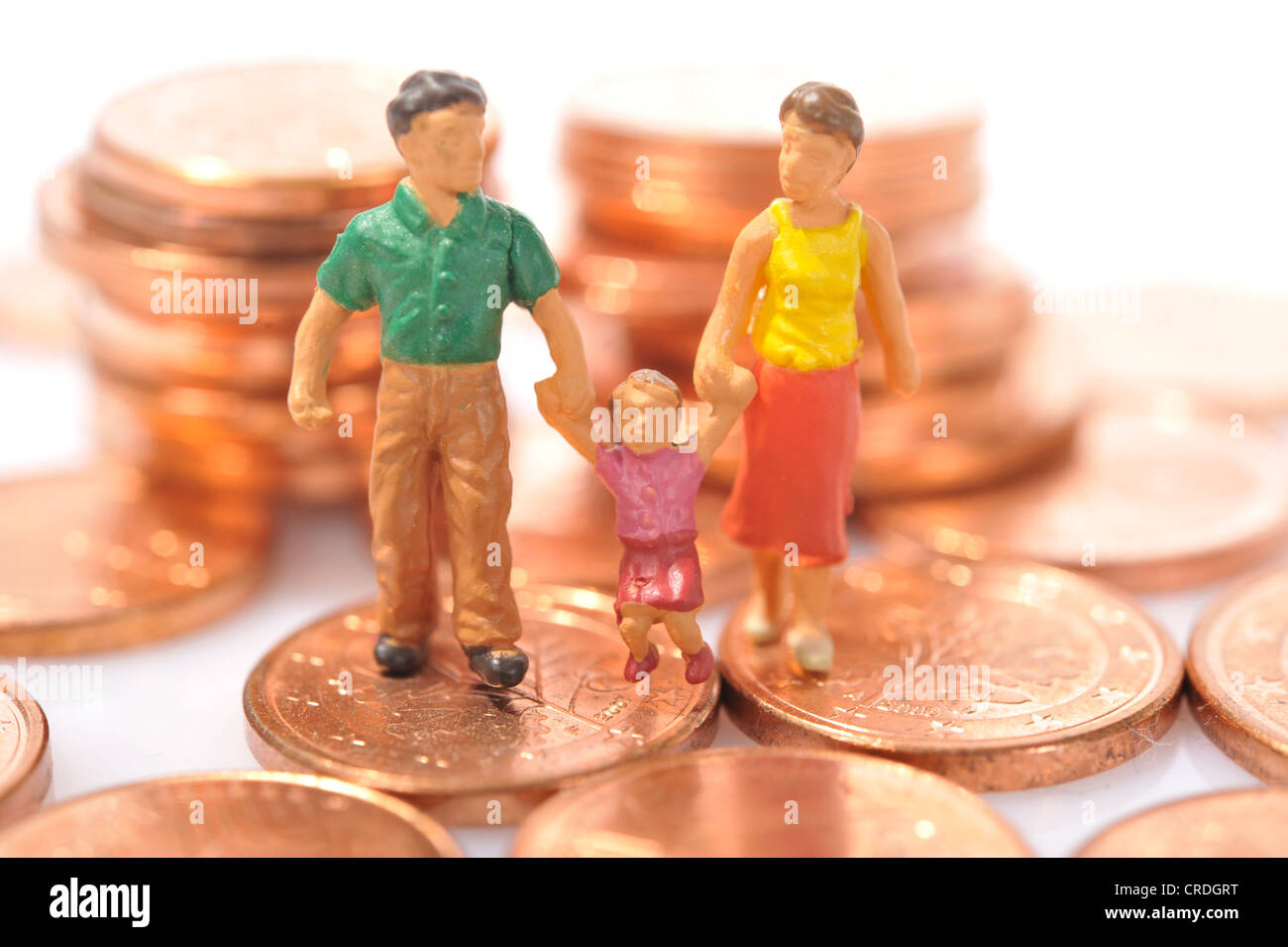 Figurine, famiglia su euro cent Foto Stock