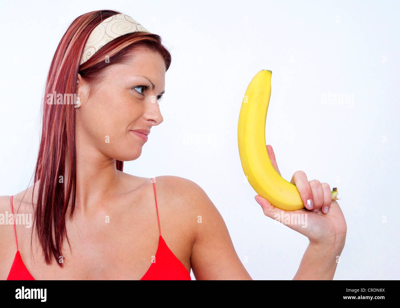 Donna con banana Foto stock - Alamy