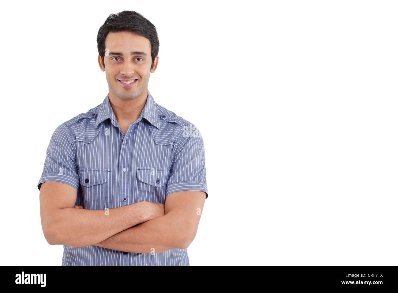 Ritratto di uomo bello con le braccia incrociate Foto Stock