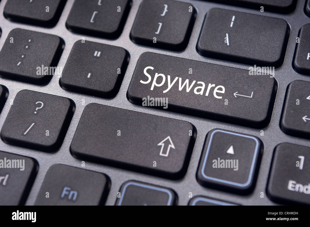 Concetti di spyware, con messaggio sul tasto Invio della tastiera. Foto Stock