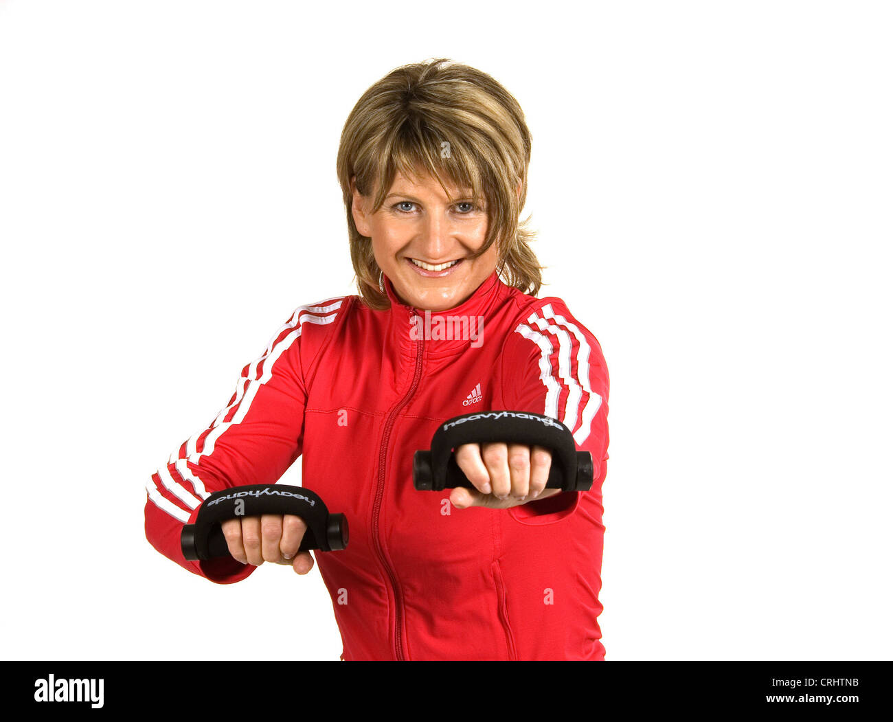 Attraente donna bionda fare sport con manubri Foto Stock