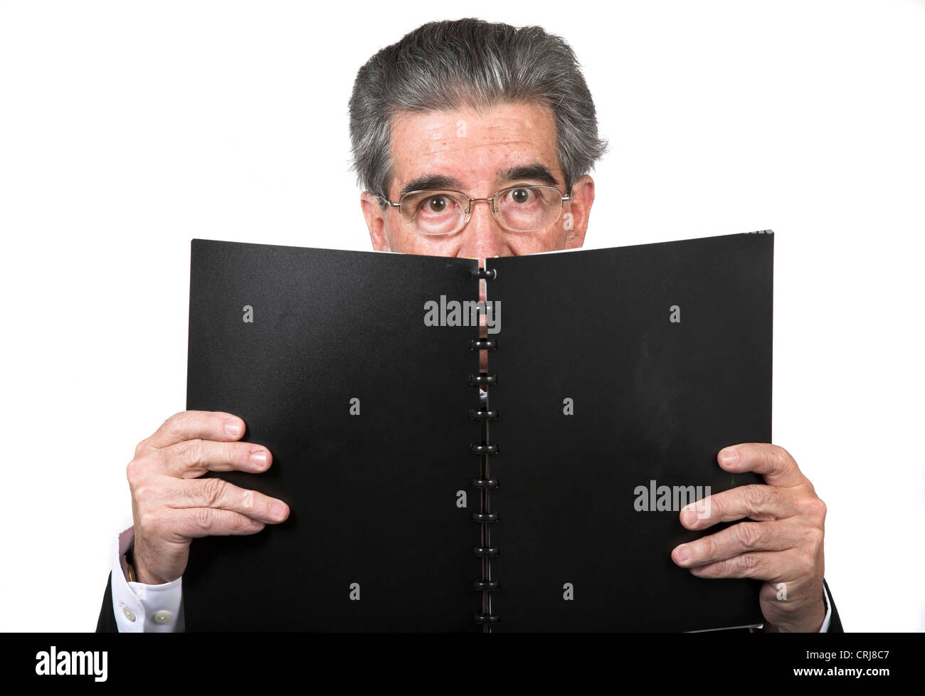 Anziani uomo d affari con un libro Foto Stock