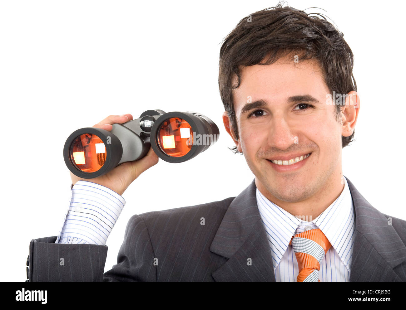 Imprenditore tenendo il binocolo in mano con un sorriso Foto Stock