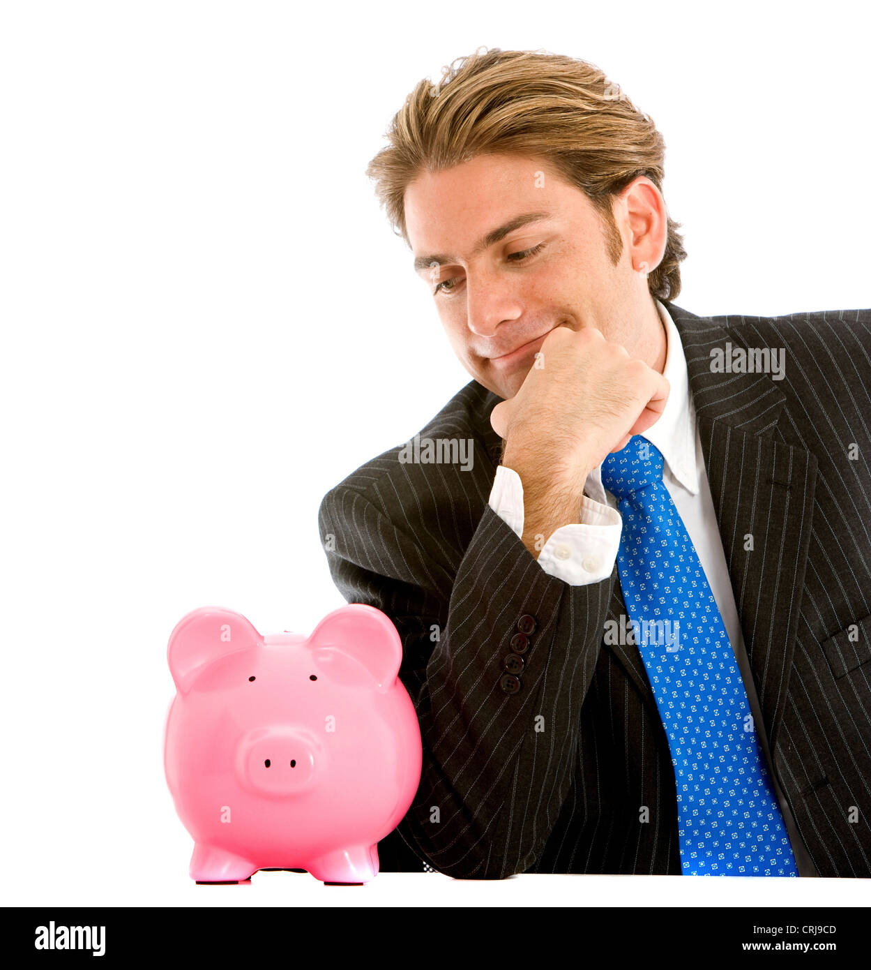 Imprenditore pensieroso guardando al suo salvadanaio Foto Stock