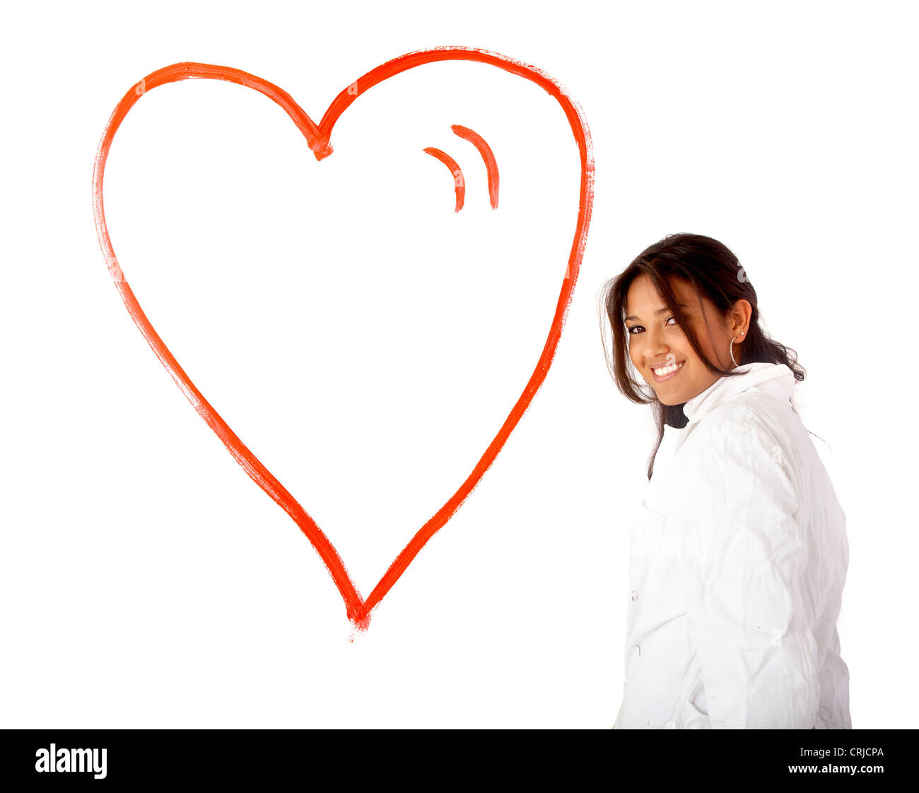 Donna di amore nella parte anteriore di un cuore dipinta sulla parete Foto Stock