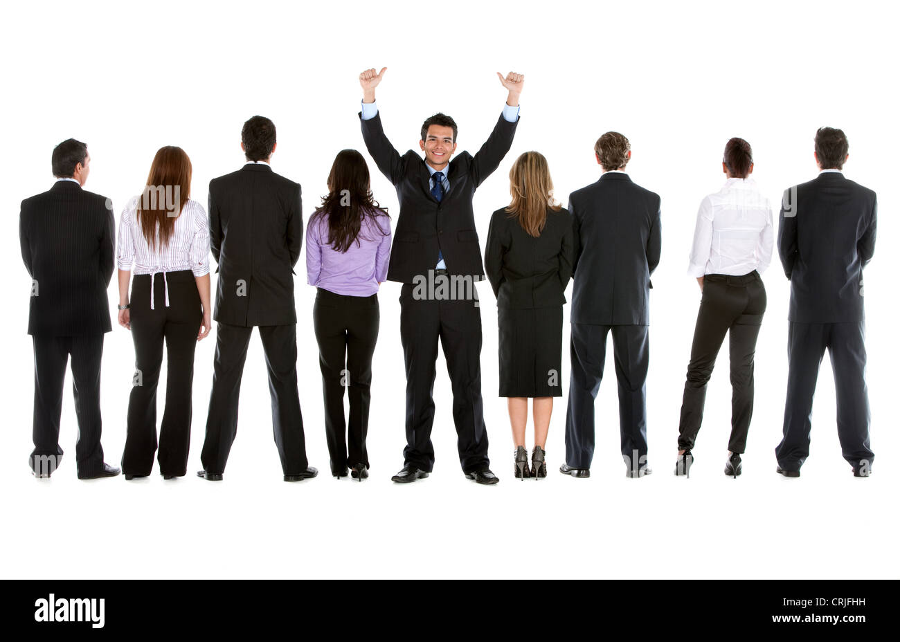 Vista posteriore di un gruppo aziendale di persone con un imprenditore rivolta verso la telecamera Foto Stock