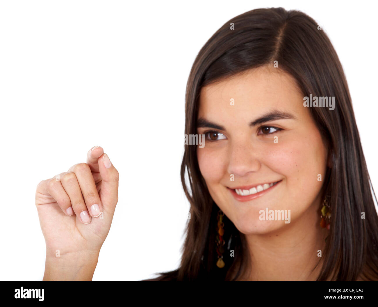 Giovane donna a scrivere qualcosa con il suo dito indice su un immaginario vetro nella parte anteriore della sua Foto Stock