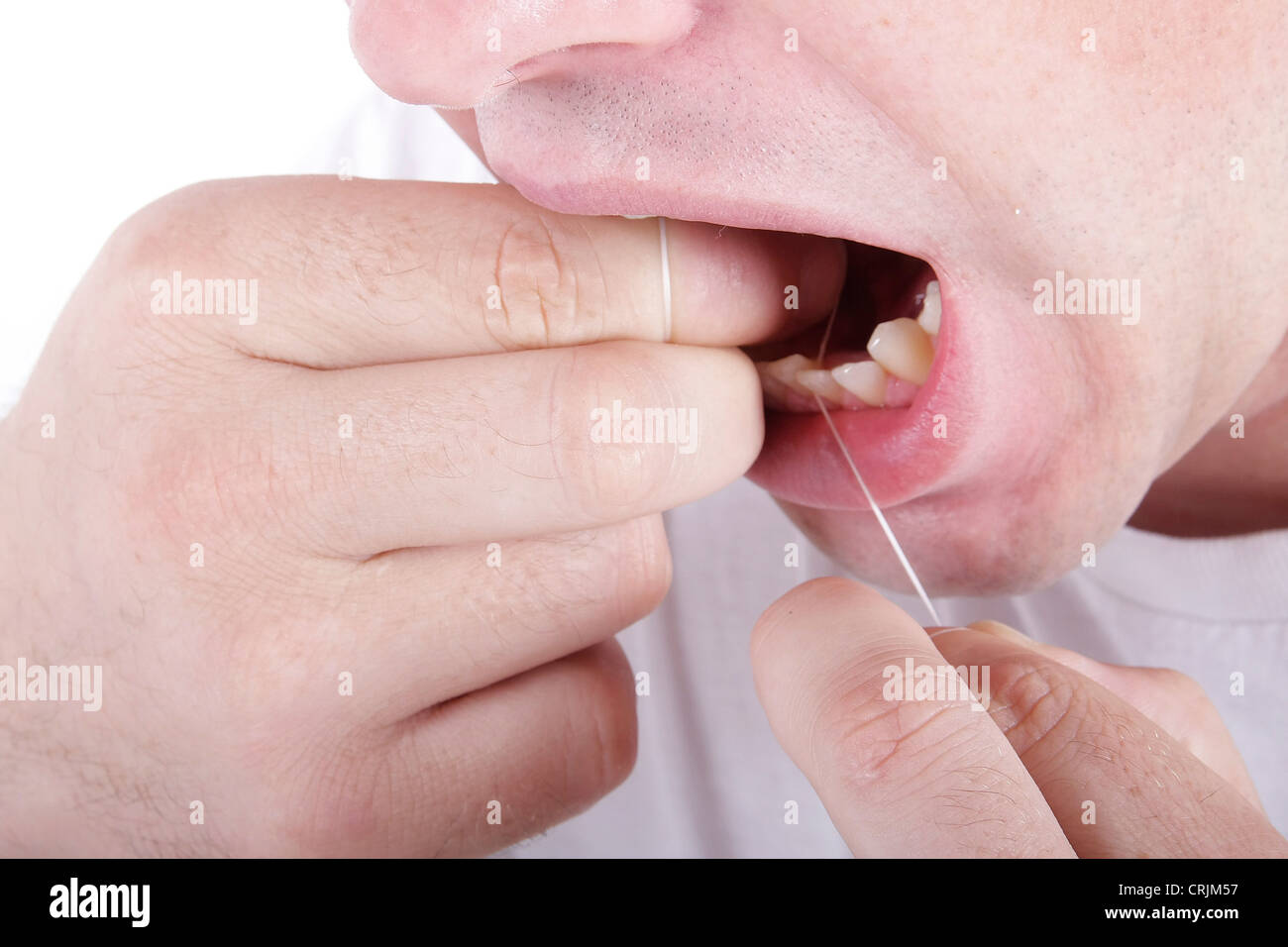 Per le cure dentarie con filo interdentale, igiene orale Foto Stock