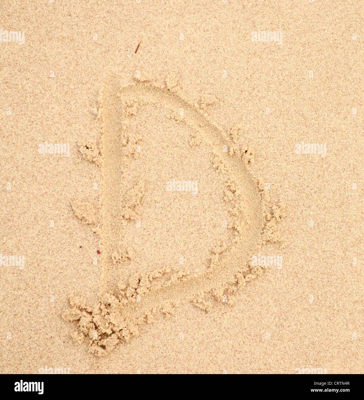 D lettera scritta nella sabbia Foto Stock