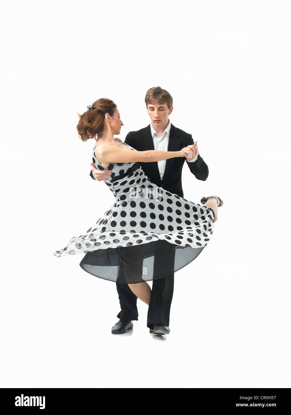 Coppia giovane ballare il tango argentino, su sfondo bianco Foto Stock