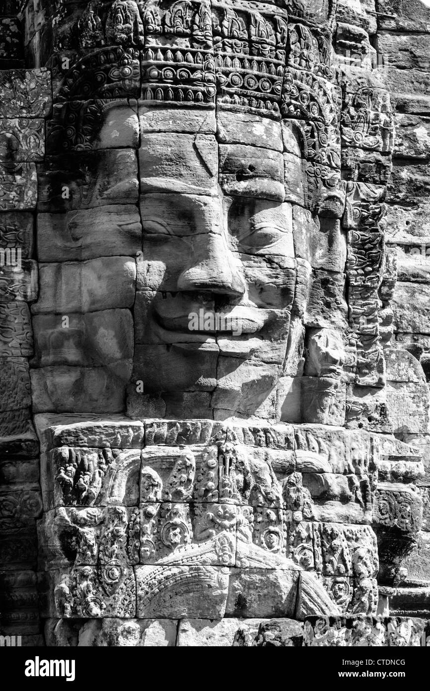 Pietra scolpita facce del tempio Bayon in Angkor Thom, Cambogia Foto Stock