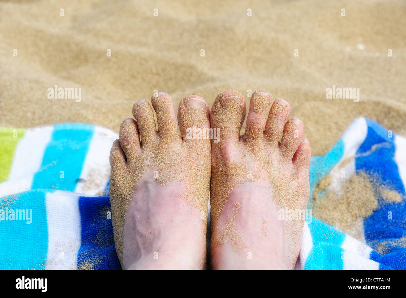 Piedi di sabbiose maschili Foto Stock