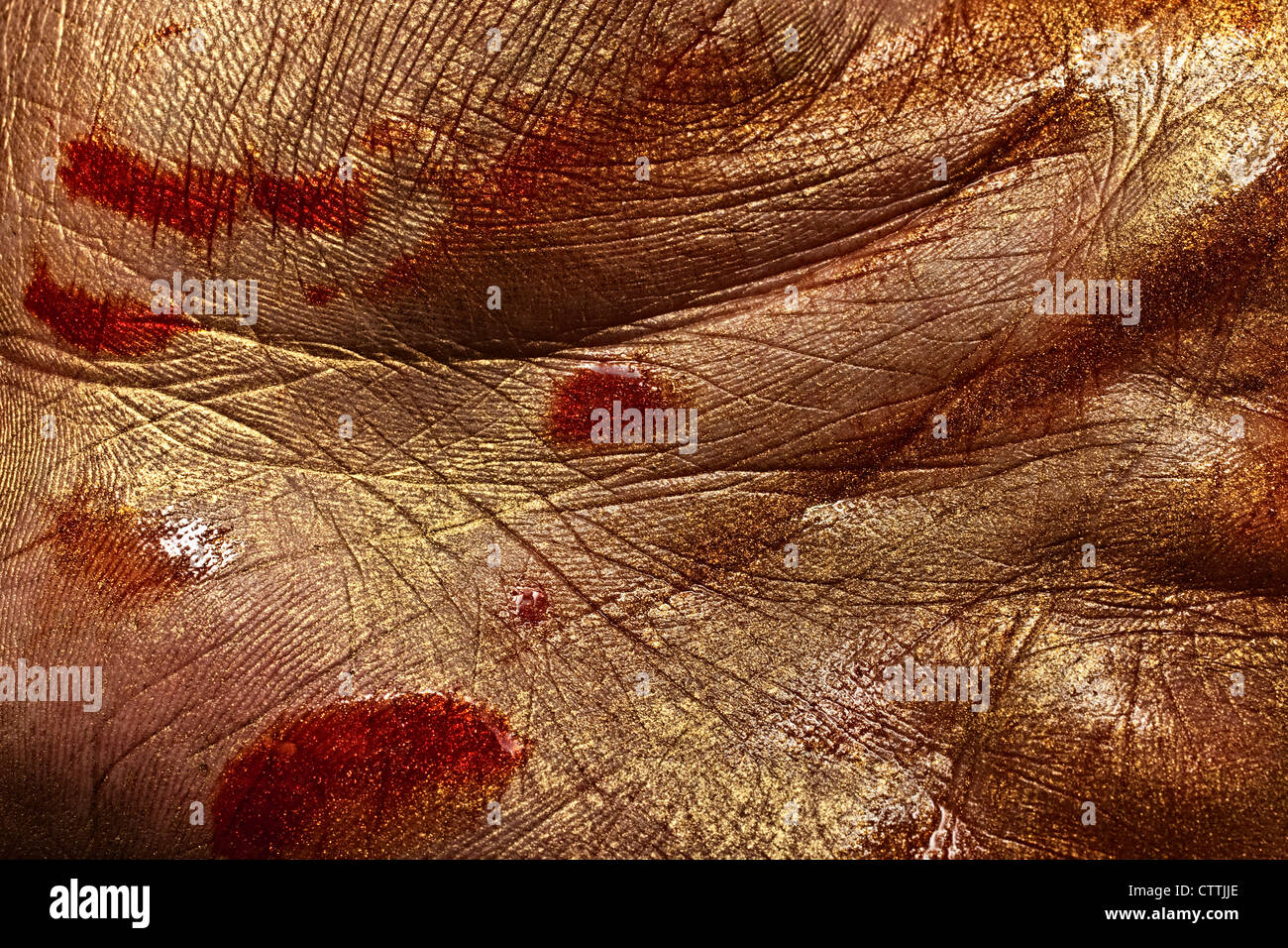 La pelle umana in vernice Oro e sangue Foto Stock