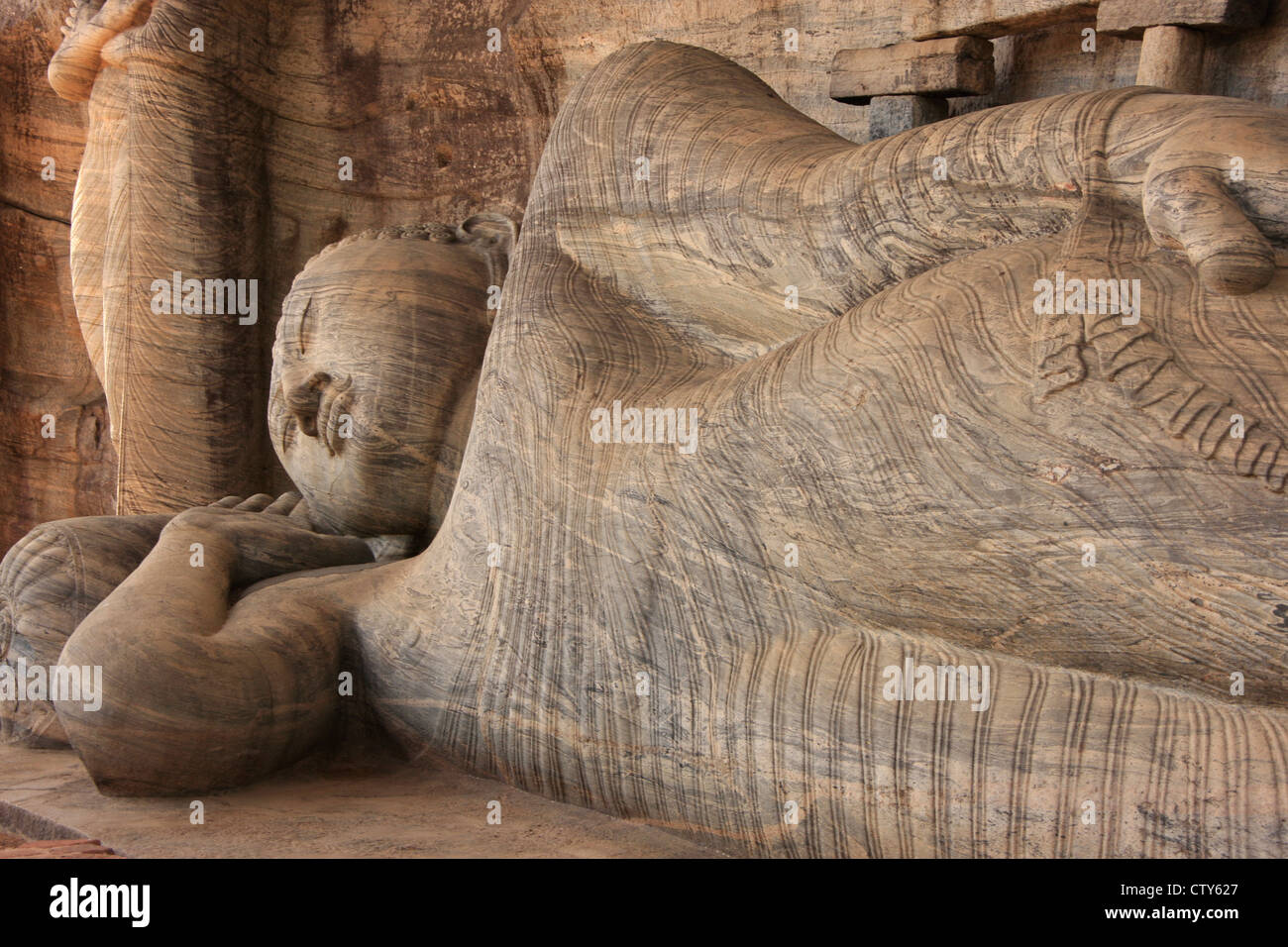 Buddha reclinato scolpito dal rock, Polonnaruwa, Sri Lanka Foto Stock