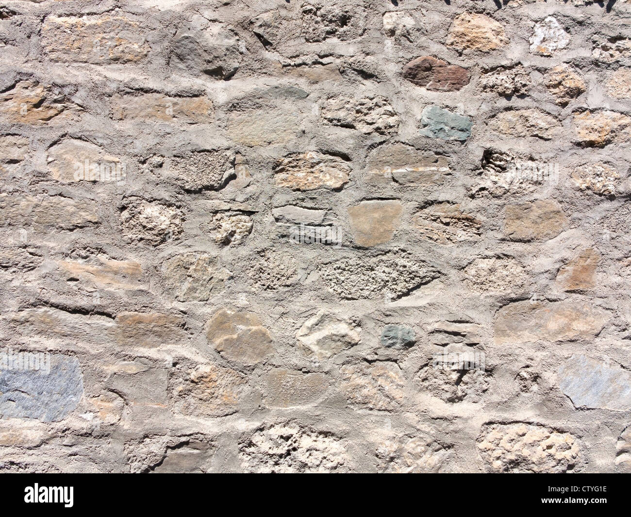 Una immagine di sfondo di un muro di pietra Foto Stock