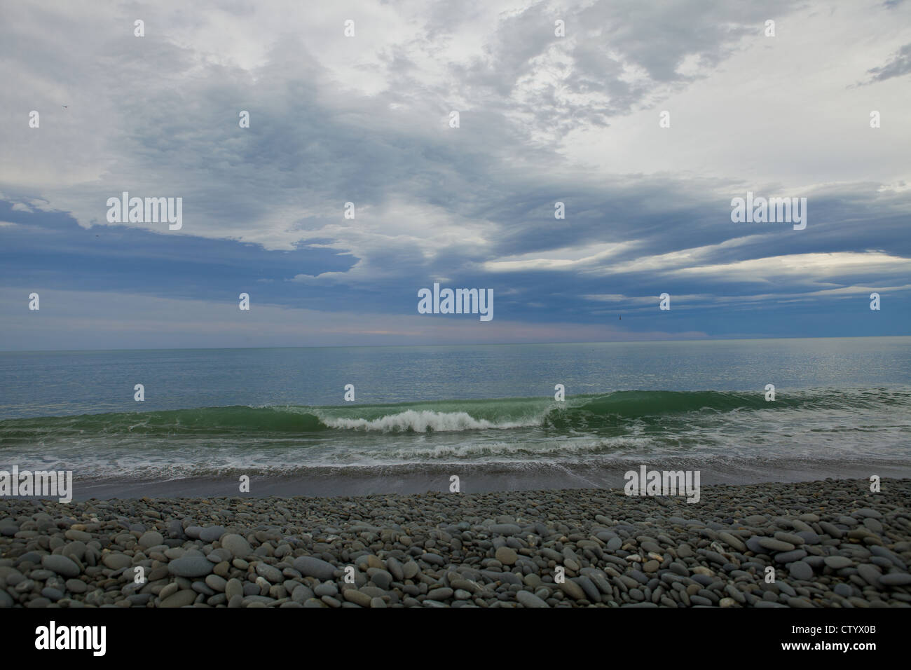 Le onde del mare portano la loro storia a voi Foto Stock