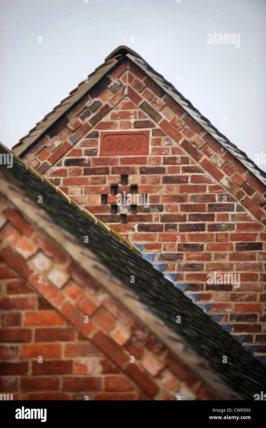 Mattone dettaglio sul timpano di un fienile conversione in corso Warwickshire, Regno Unito Foto Stock