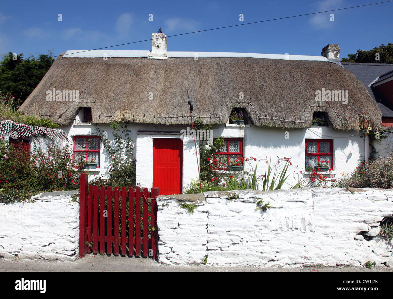 Con il tetto di paglia fishermans cottage, Clogherhead, Co Louth, Irlanda Foto Stock