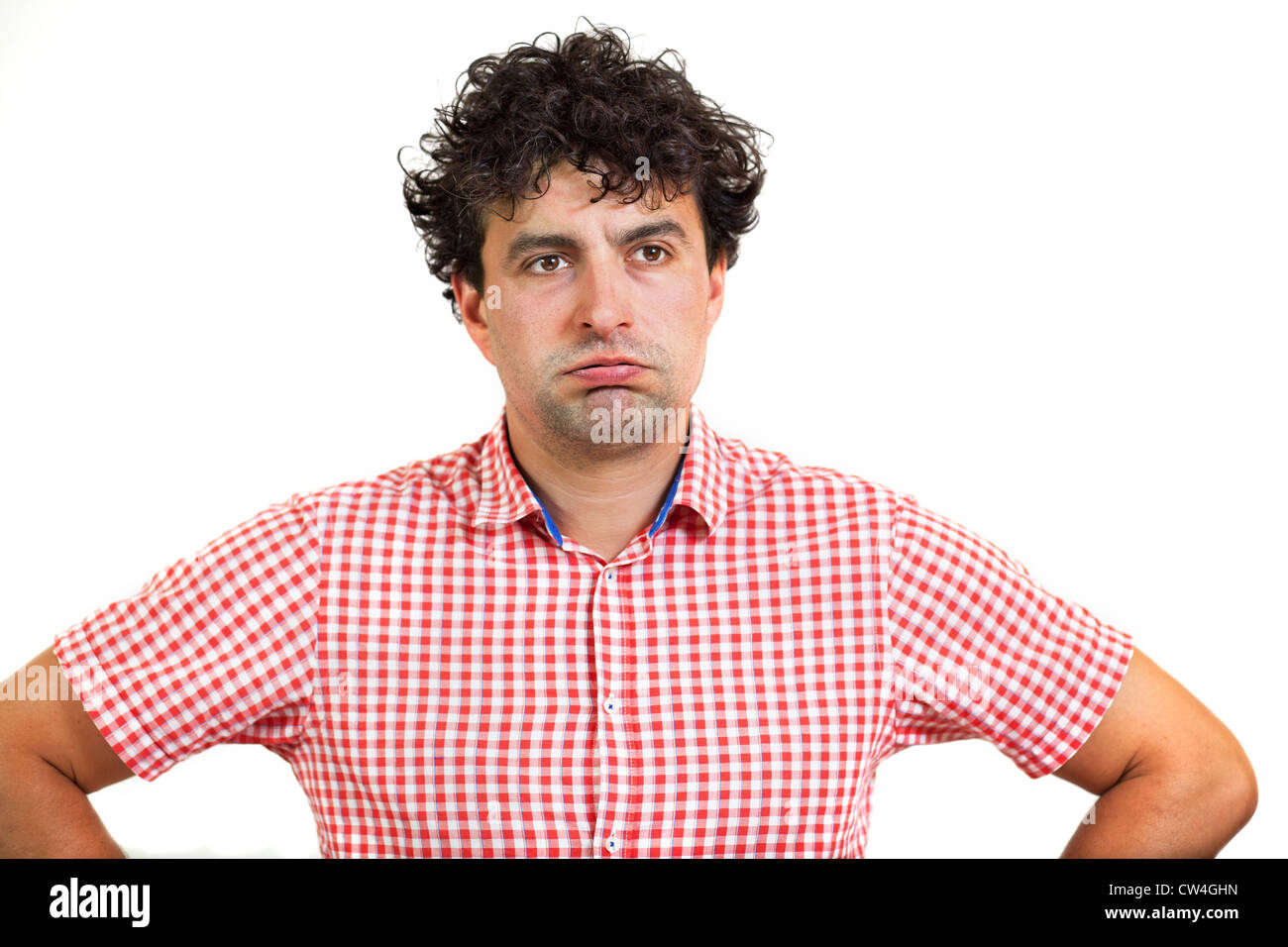 Uomo che guarda annoiato o esasperato, isolati su sfondo bianco Foto Stock