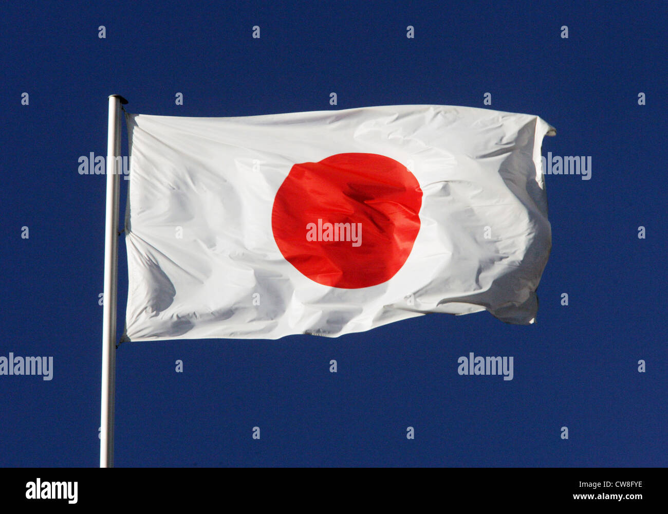 Foto di simbolo, bandiera nazionale del Giappone nel vento Foto Stock