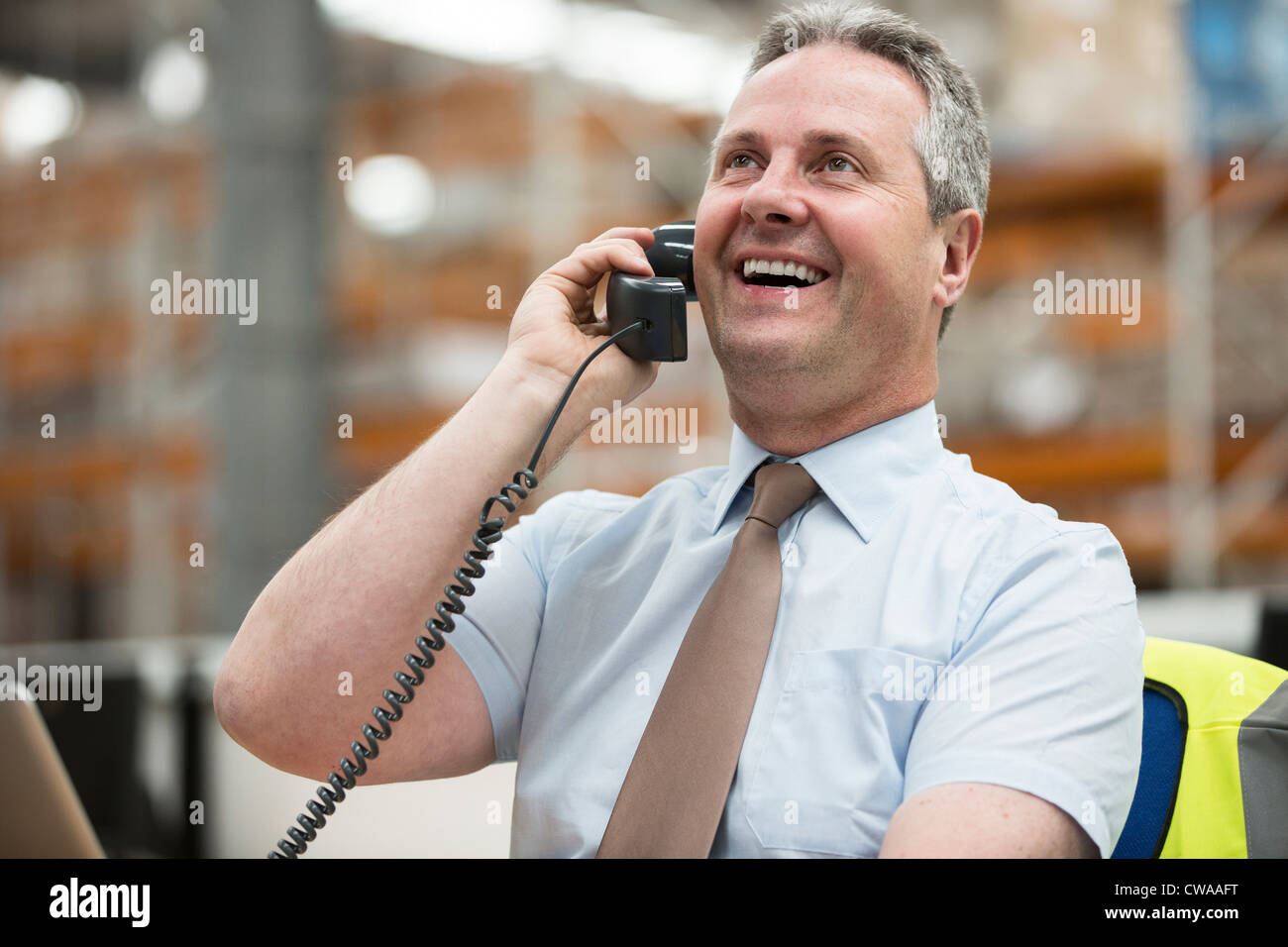 Responsabile di Magazzino sul telefono Foto Stock