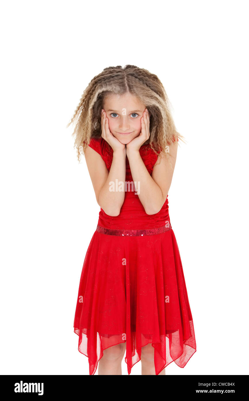 Ritratto di ragazza in rosso tonaca con testa in mani su sfondo bianco Foto Stock