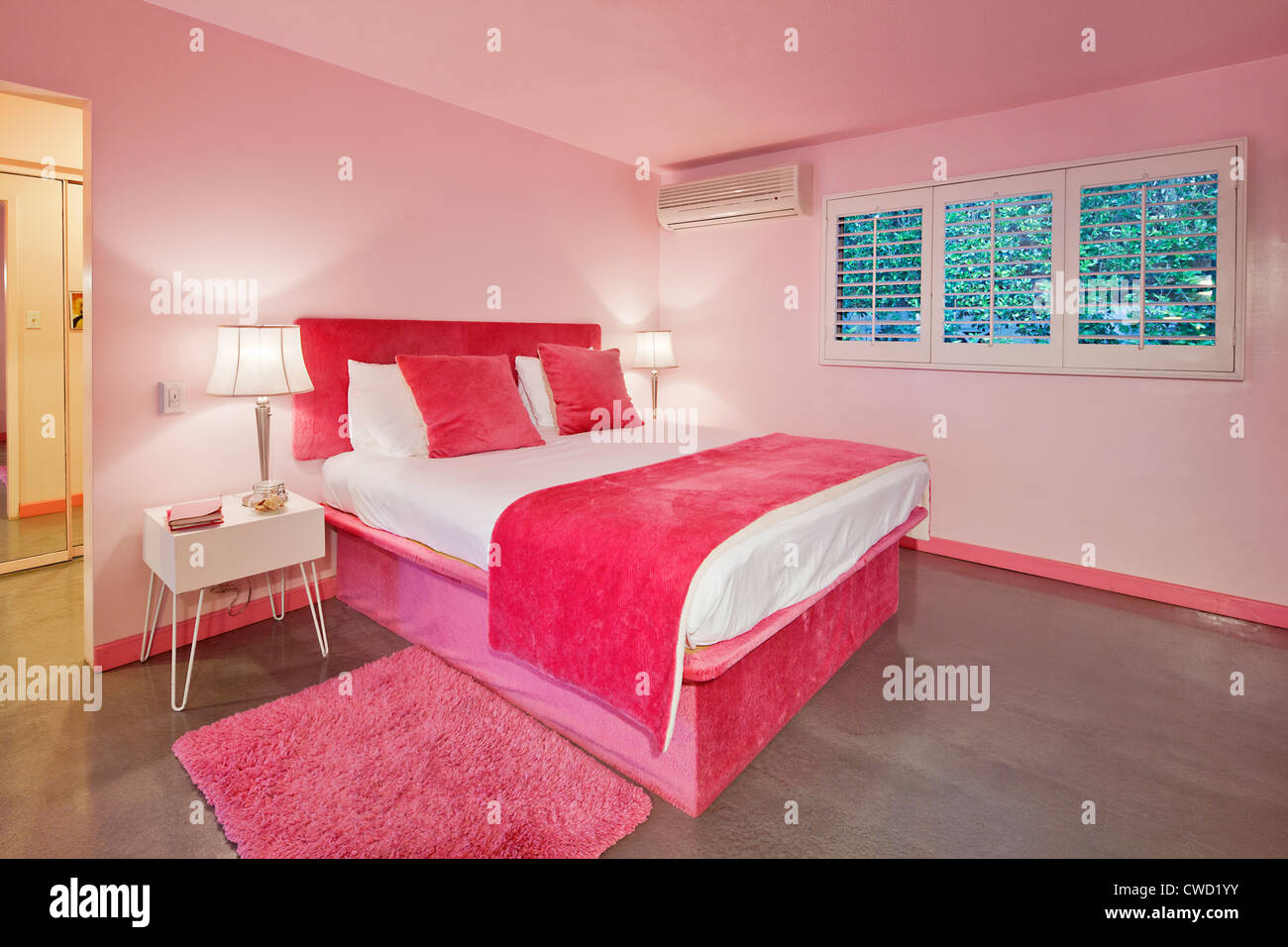 Il design degli interni della camera rosa Foto Stock