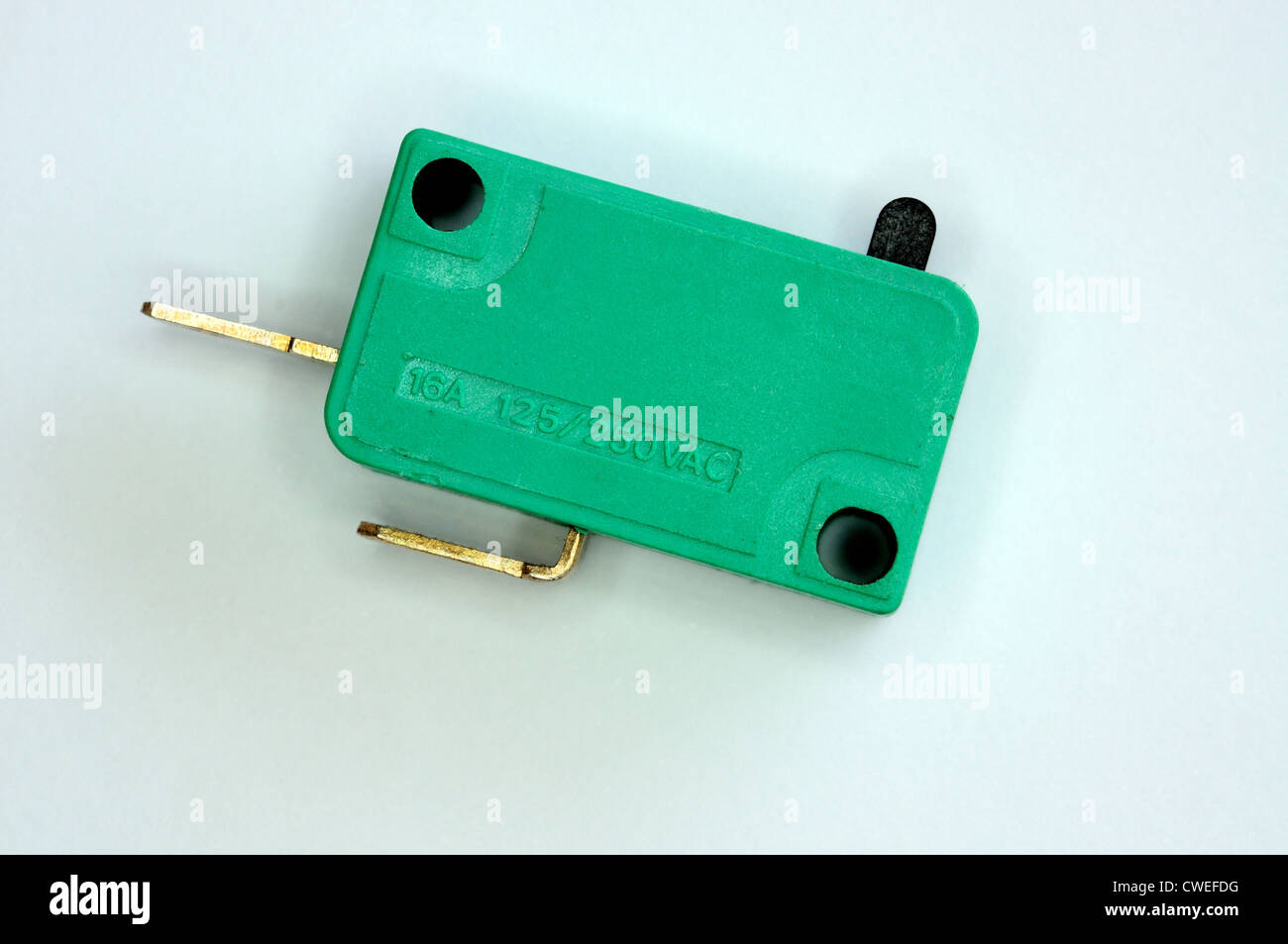 Green 16 amp 125/250 volt ac micro interruttore. Foto Stock