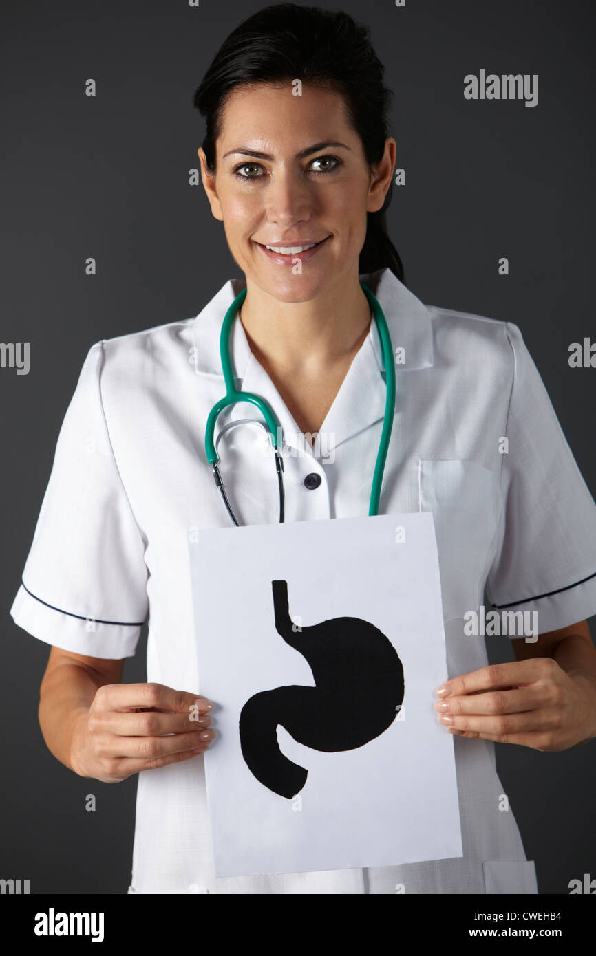 American nurse holding disegno a inchiostro dello stomaco Foto Stock