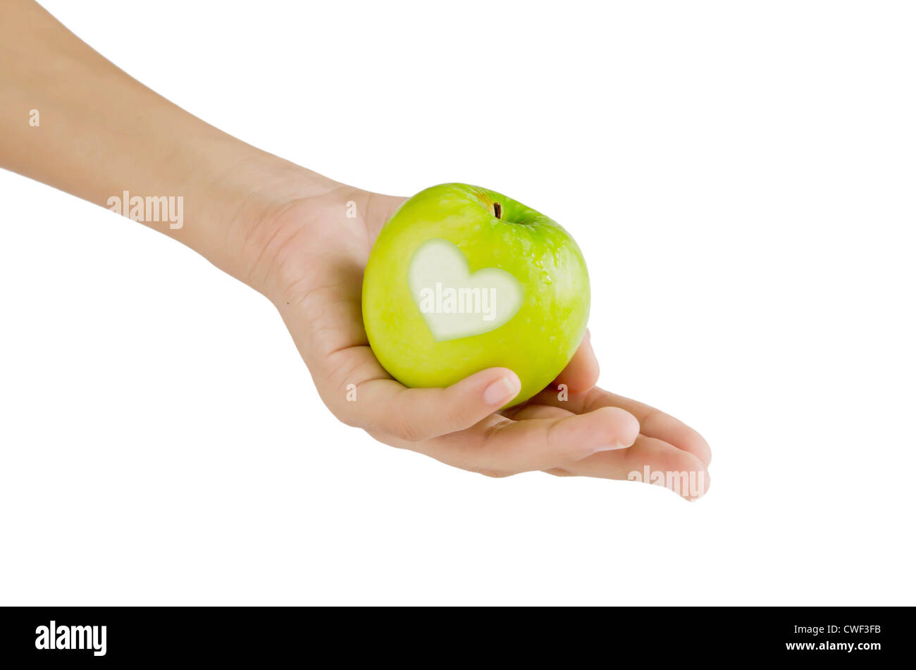 Canto e mela verde a forma di cuore su sfondo bianco Foto Stock