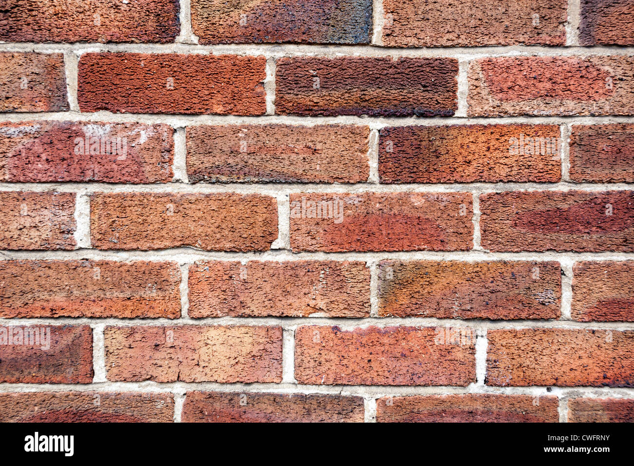 Muro di mattoni rosso. Foto Stock