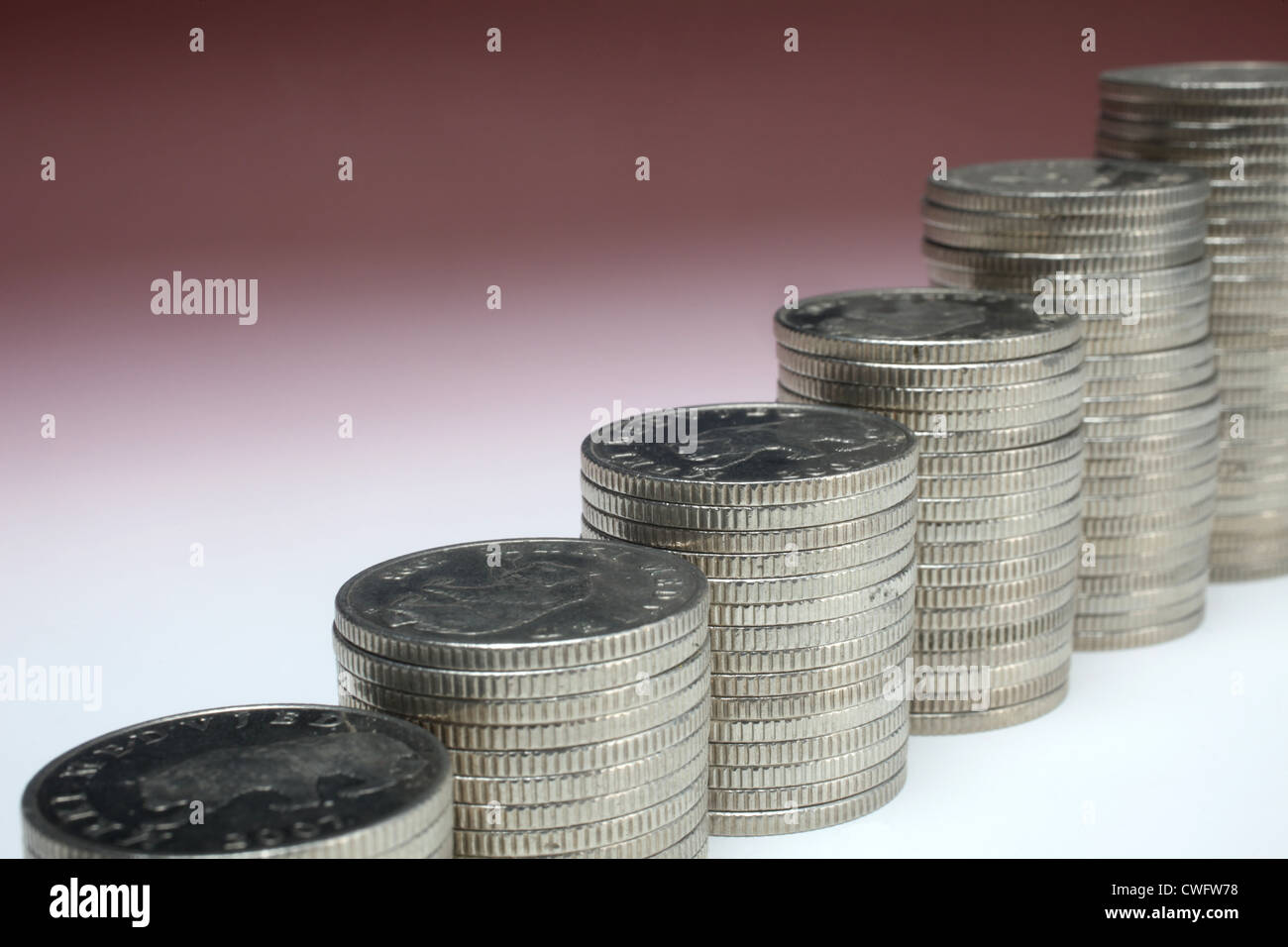 Pile di monete di denaro Foto Stock