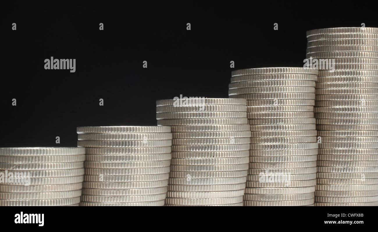 Pile di monete di denaro Foto Stock