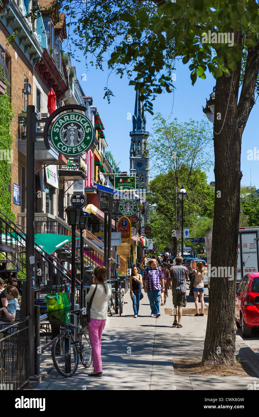Bar, caffè, ristoranti e negozi lungo la Rue Saint-Denis nel Quartier Latin (Quartiere Latino), Montreal, Quebec, Canada Foto Stock