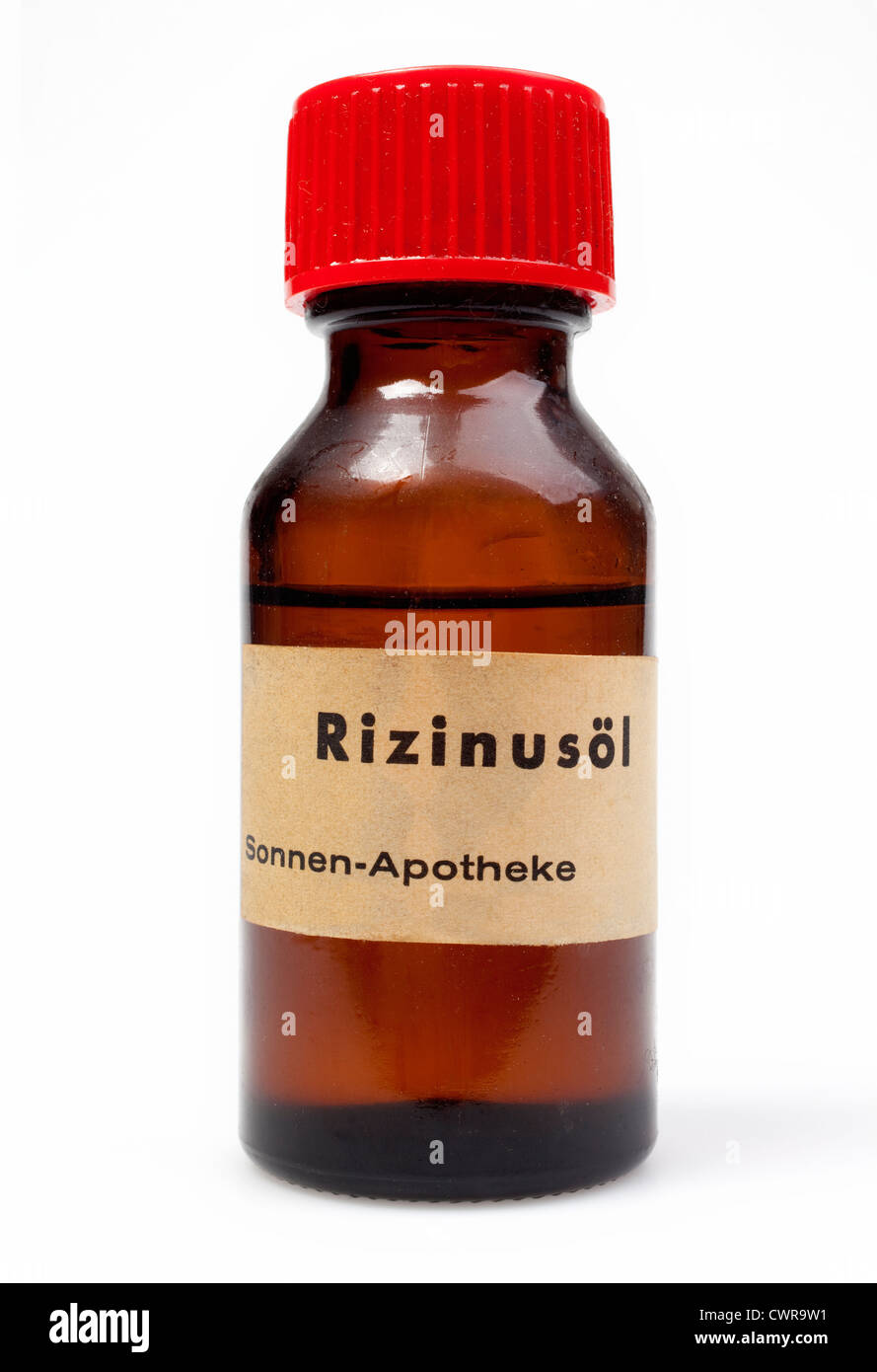 Olio di ricino impianto (Ricinus communis), piccola bottiglia di olio Foto Stock