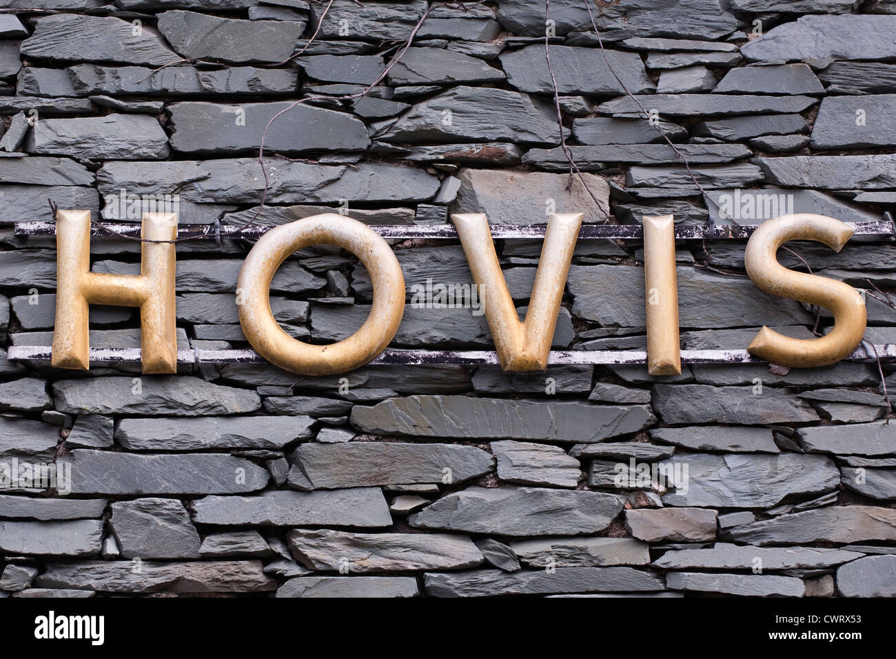 Un vecchio Hovis ha segno pubblicità su una casa di pennini parete. Foto Stock