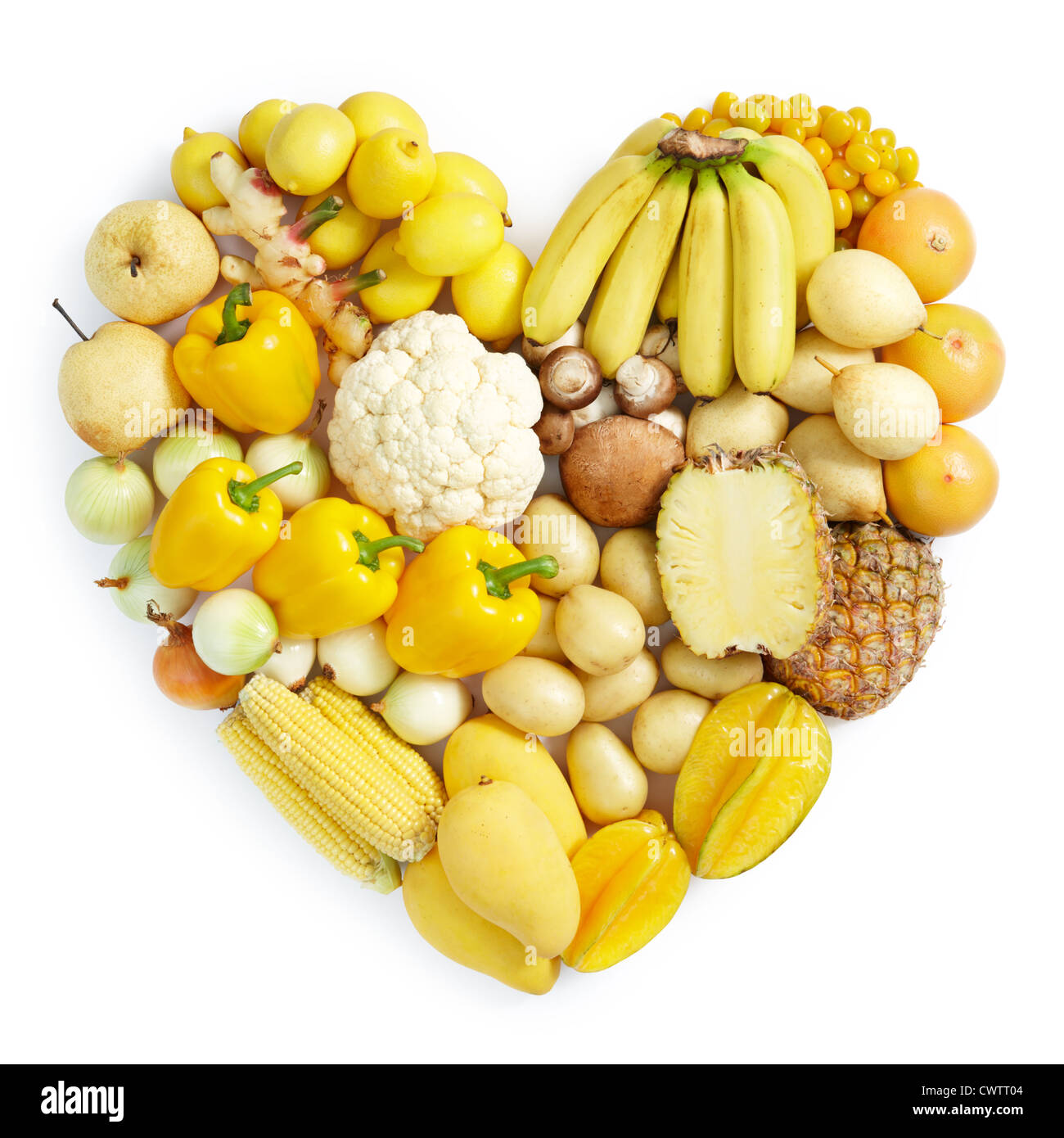 Forma di cuore forma da diversi tipi di frutta e verdura in colore giallo Foto Stock