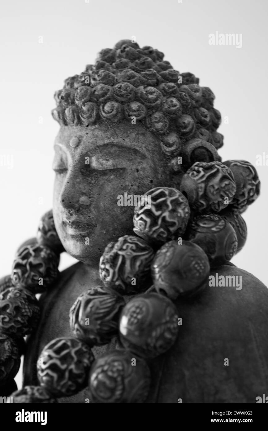Una scultura di Buddha Foto Stock