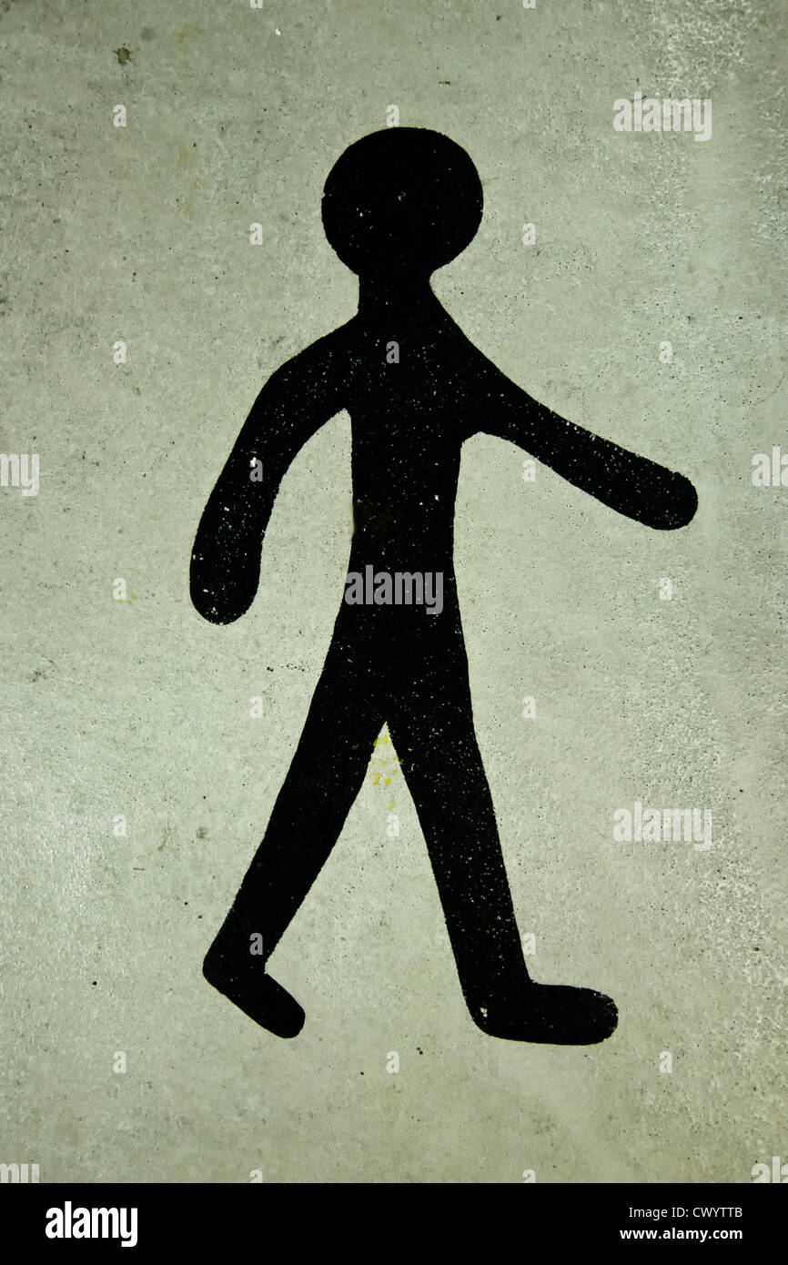 Stick man walking dipinta su calcestruzzo Foto Stock