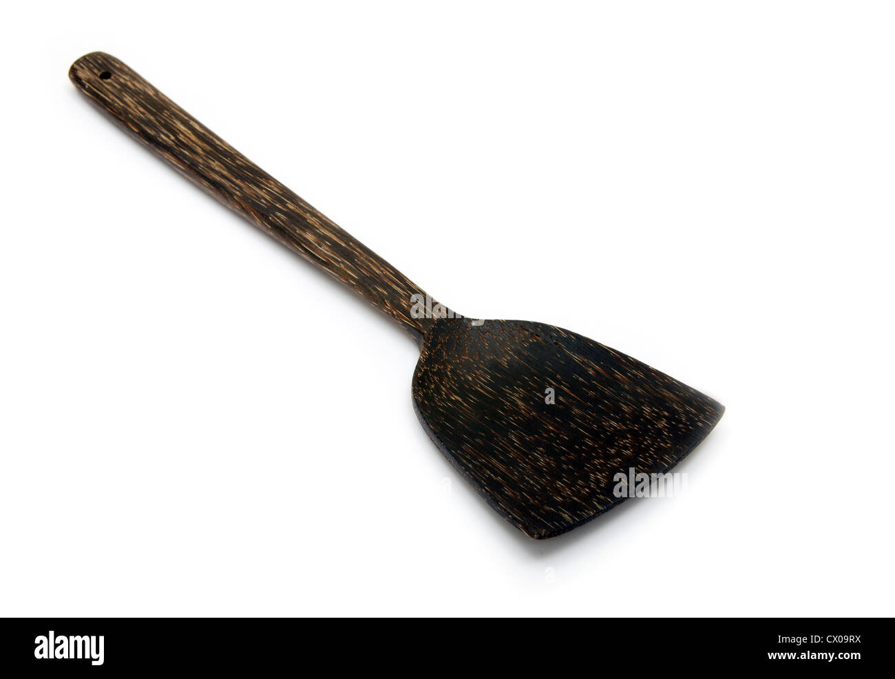 Cucchiaio di legno isolato su uno sfondo bianco. Foto Stock