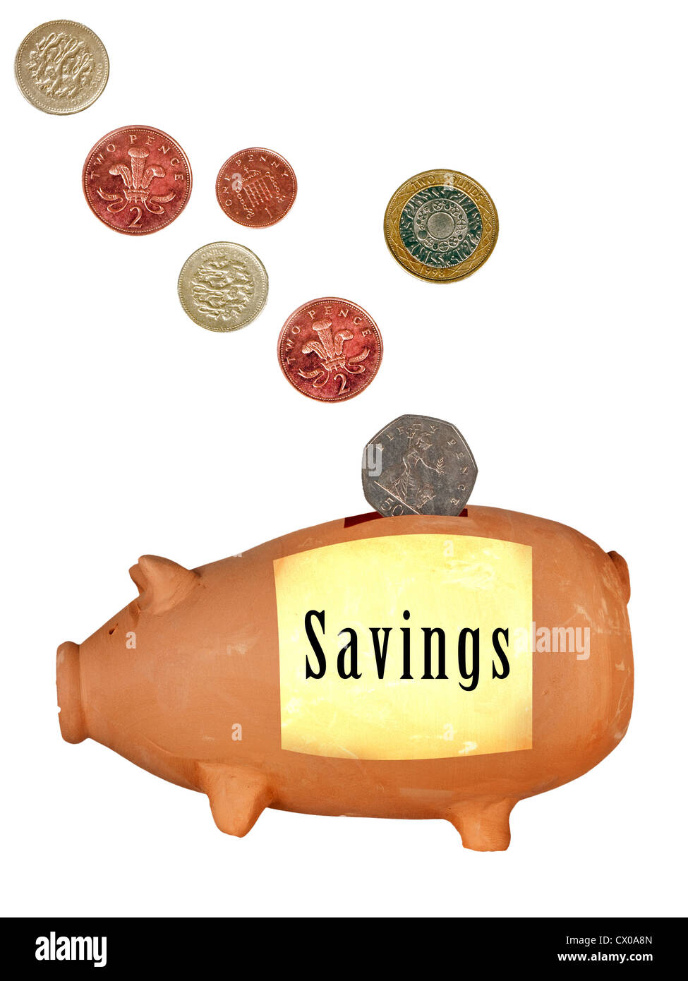 Maiale in terracotta casella di denaro con monete DEL REGNO UNITO Foto Stock