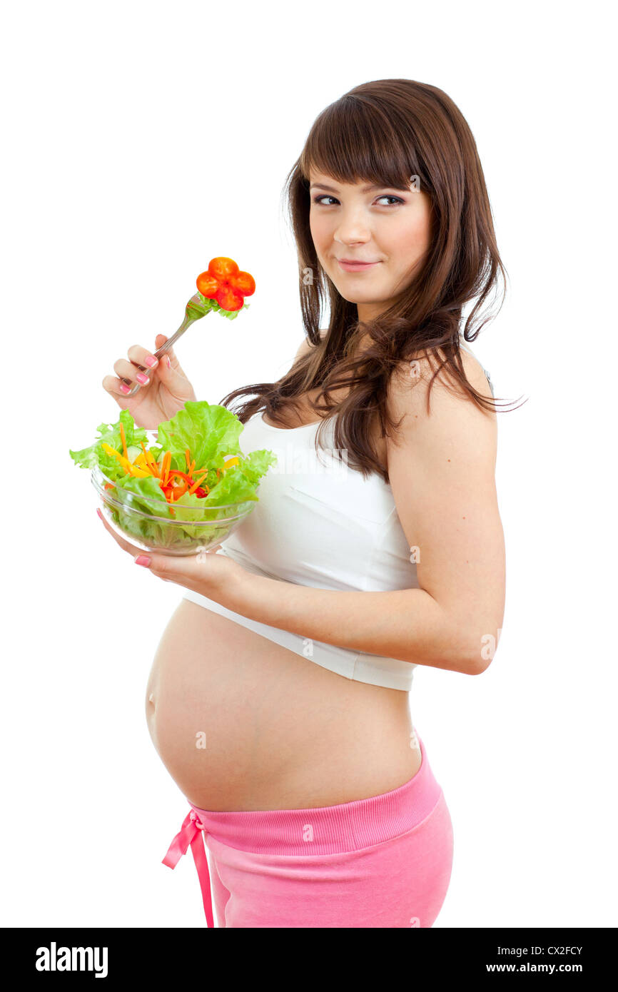Donna incinta di mangiare cibo sano Foto Stock
