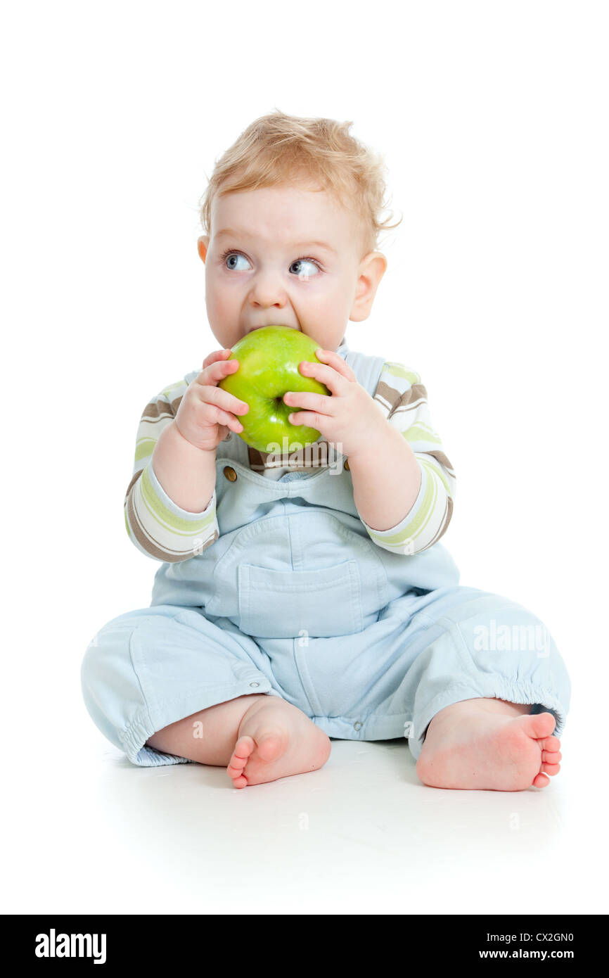 Baby boy mangiare cibo sano isolato Foto Stock