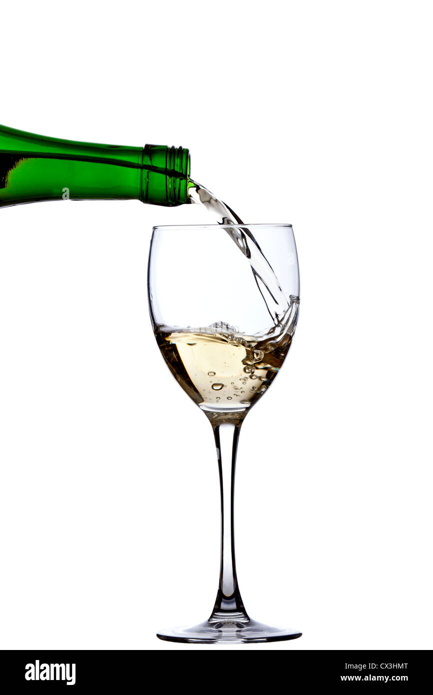Versare il vino bianco Foto Stock