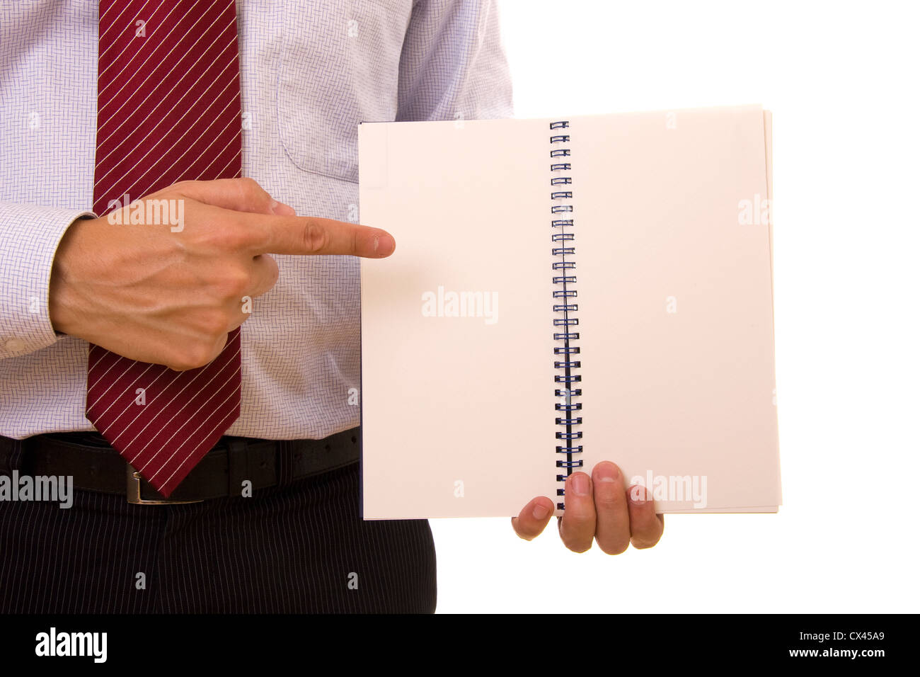 Un uomo d'affari puntando con il suo dito di un notebook Foto Stock
